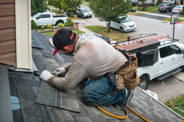 Professional Roofing technician working in Adams, MA